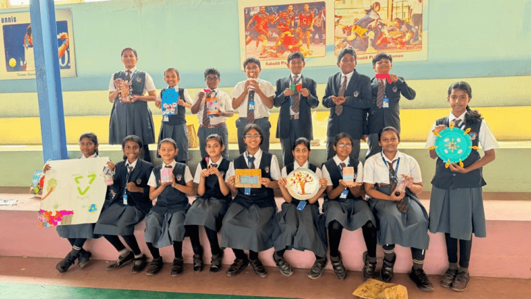 Students at a real morning assembly in the school ground. Alt: "Morning assembly at BRS Global School's CBSE campus in Attibele