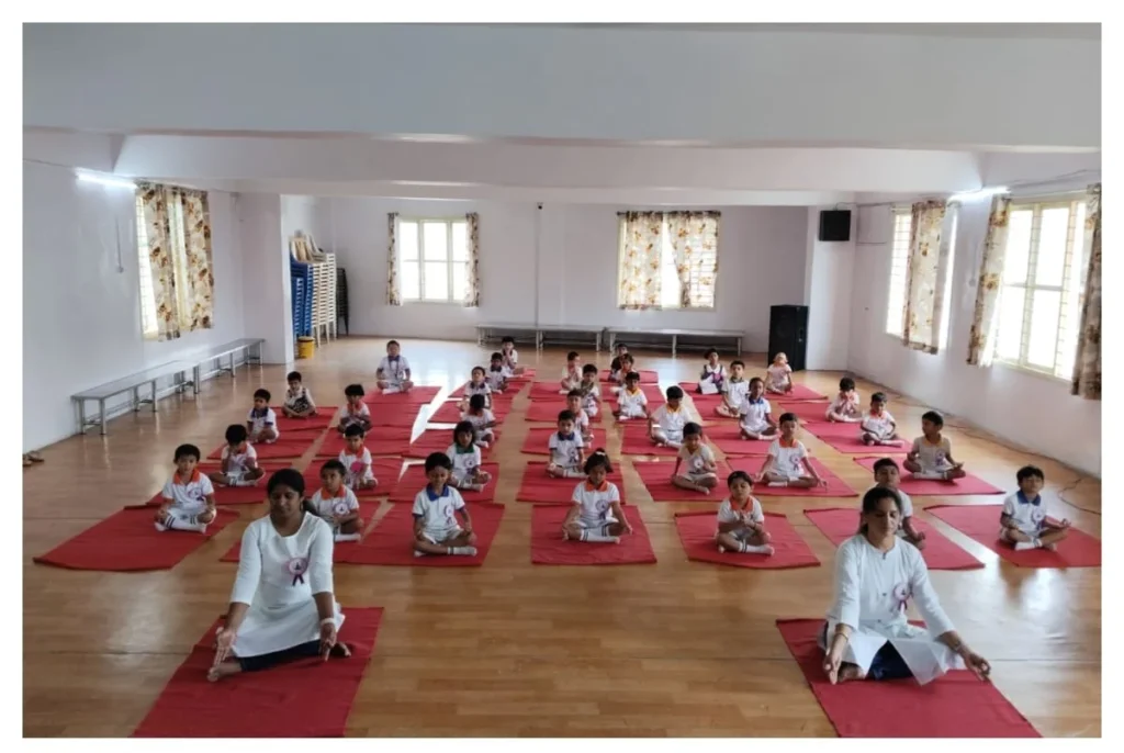 Montessori students practising yoga during International Yoga Day at BRS Global School, one of the best CBSE schools in Sarjapur Road.