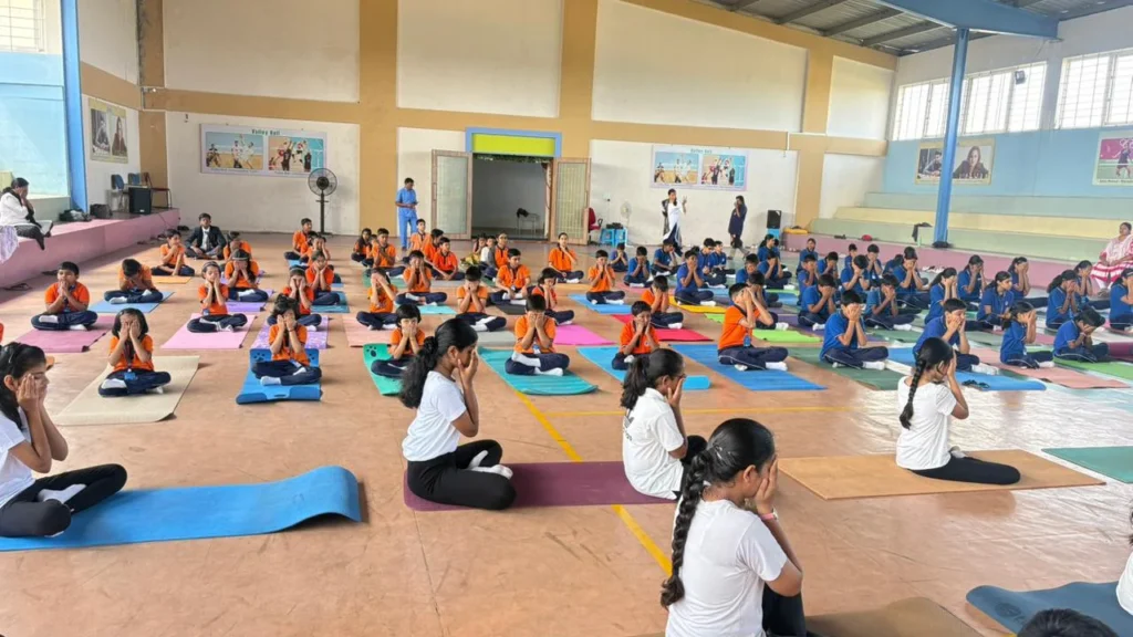 Students performing yoga during International Yoga Day at BRS Global School Attibele, one of the top cbse schools in bangalore.