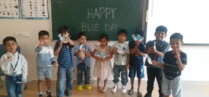 Montessori students celebrating Blue Day at BRS Global School Attibele, one of the trusted schools in Anekal.