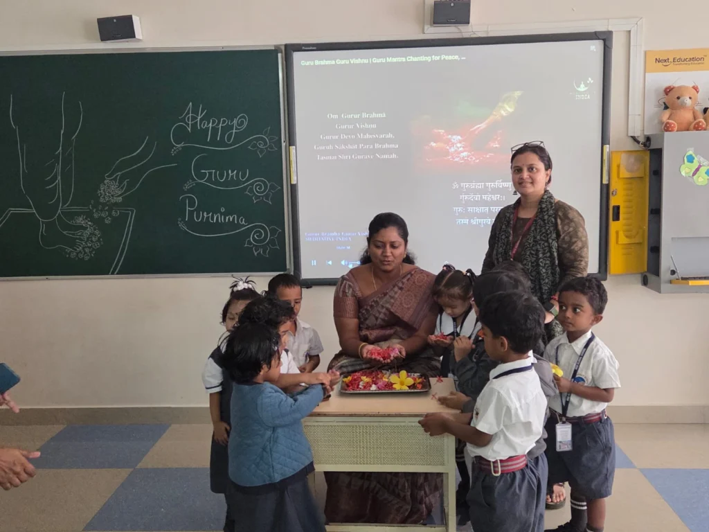Montessori students celebrating Guru Purnima at BRS Global School, one of the leading schools in Attibele.