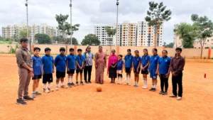 Principal Mrs. Alexandra Thangam encouraging students at the football event, reflecting excellence among schools in Hosur.