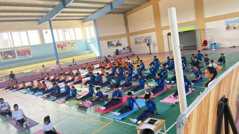 Yoga instructor guiding students during a school yoga session at one of the best schools in Haralur Road.