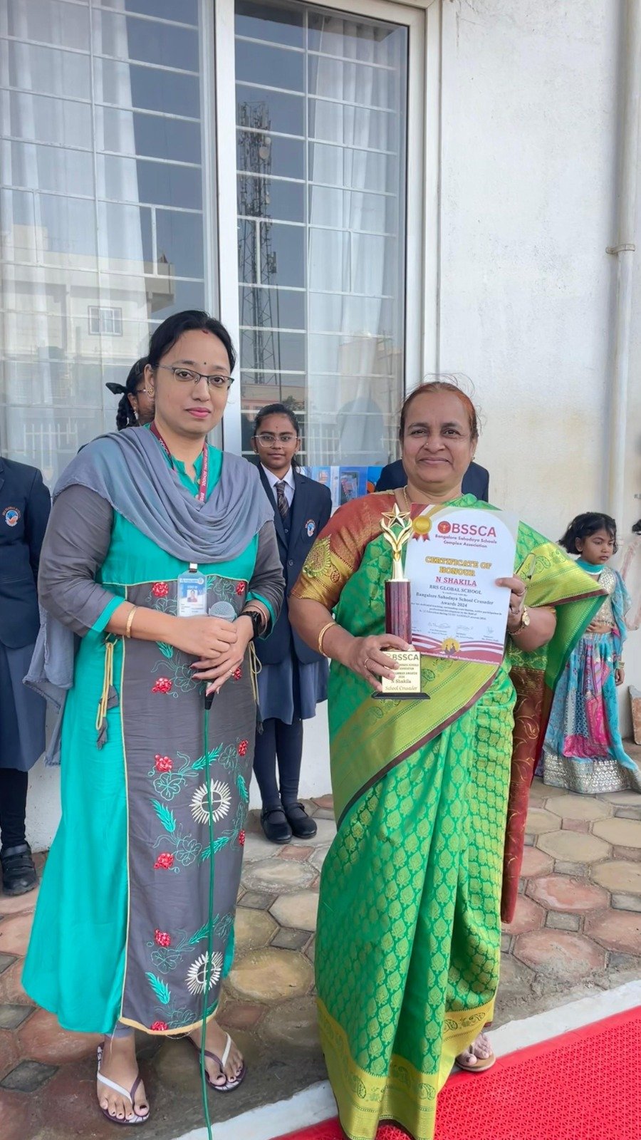 BRS Global School Principal receiving BSSCA Certificate of Honour at schools in Attibele