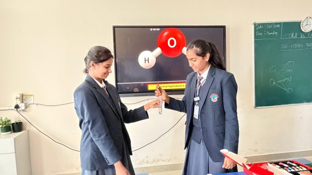 Class 9 students conducting a Science experiment at BRS Global School – a CBSE school in Chandapura