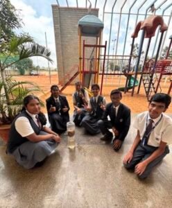 Grade 10 students performing a DIY water filter activity at BRS Global School Attibele, one of the best CBSE schools in Anekal.