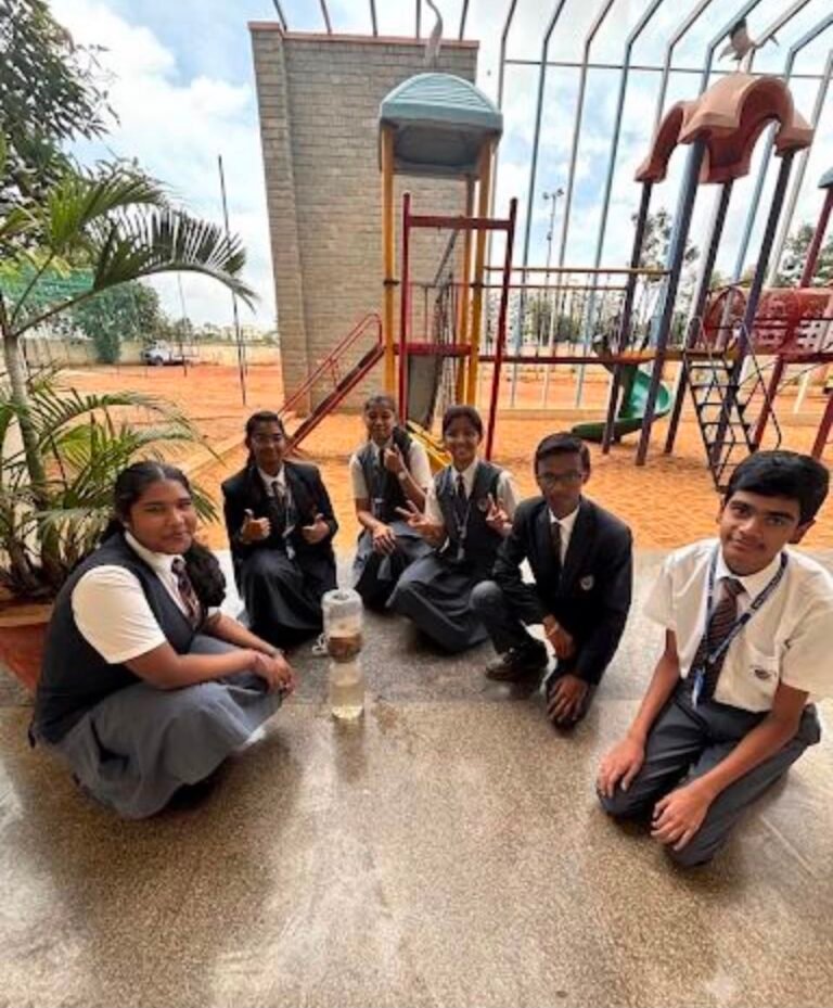 Grade 10 students performing a DIY water filter activity at BRS Global School Attibele, one of the best CBSE schools in Anekal.